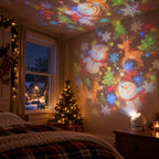 Projection light on a bedside table casting snowmen, reindeer and snowflakes across a bedroom wall and ceiling