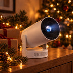 HY300 Pro New projector in white on a sideboard with wrapped presents and a Christmas tree behind
