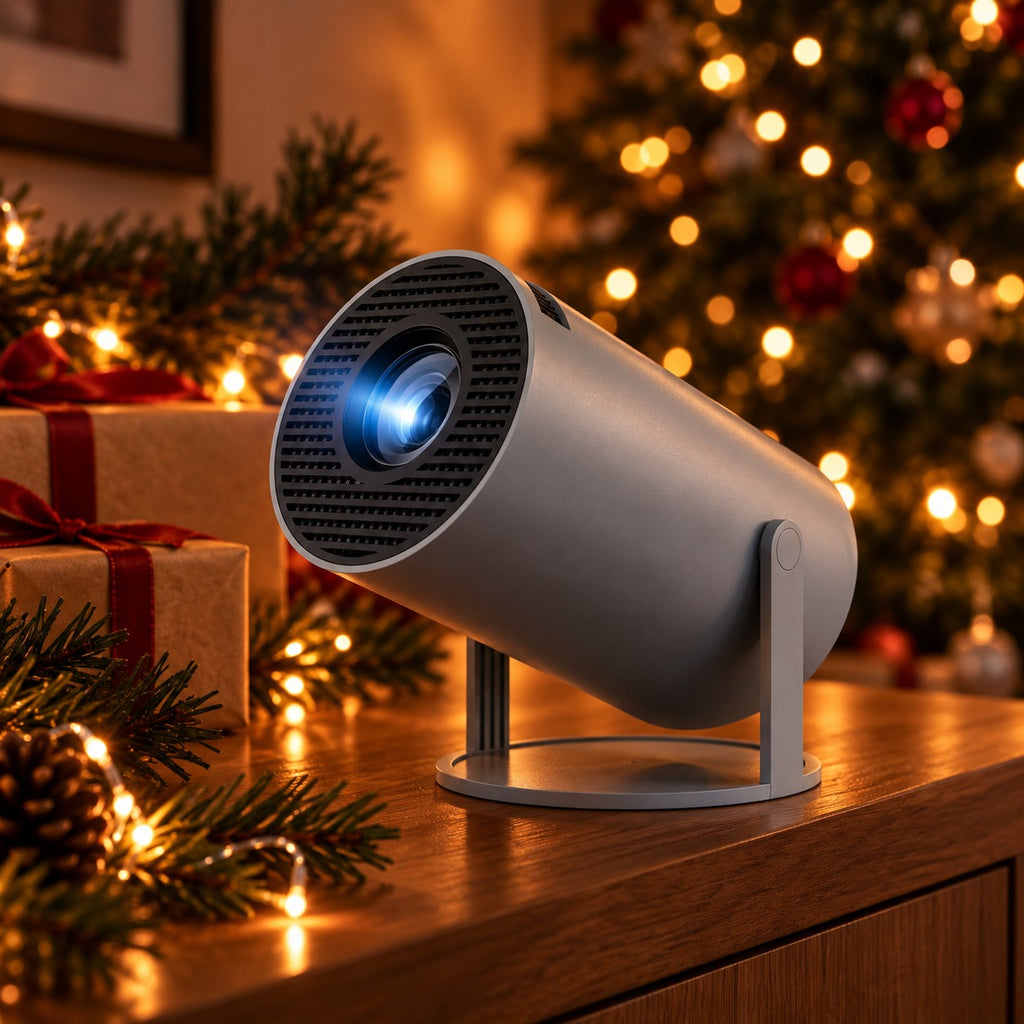 HY300 Pro projector in grey on a sideboard with wrapped presents and a Christmas tree behind