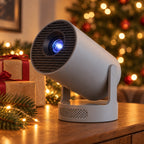 HY300 Pro New projector in grey on a sideboard with wrapped presents and a Christmas tree behind